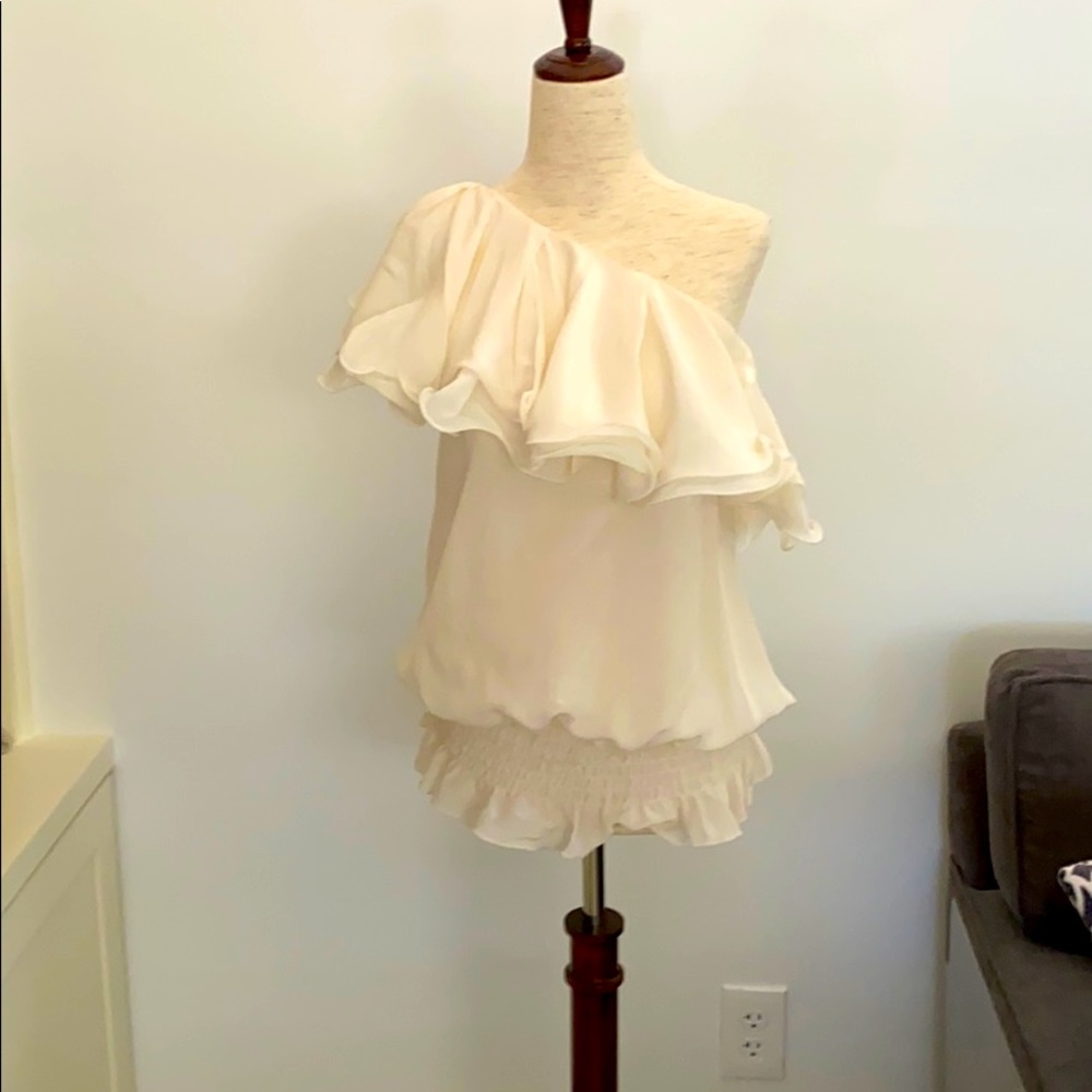 One shoulder size small flouncy cream silk top.